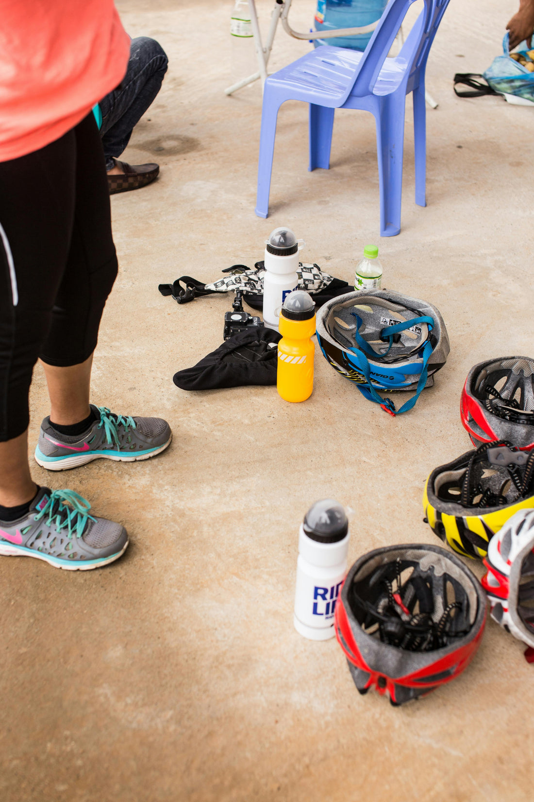Cycling gear with helmets and water bottles — essential accessories flat lay