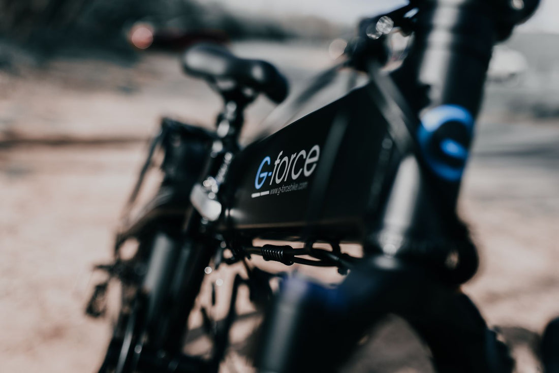 Close-up of a black electric bike, the kind of e-bike where motor placement decides how it climbs